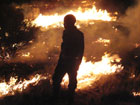 Burgersdorp Veld Fire - firefighter at night